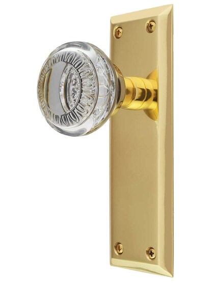 New York Door Set with Ovolo Crystal-Glass Knobs in Un-Lacquered Brass.